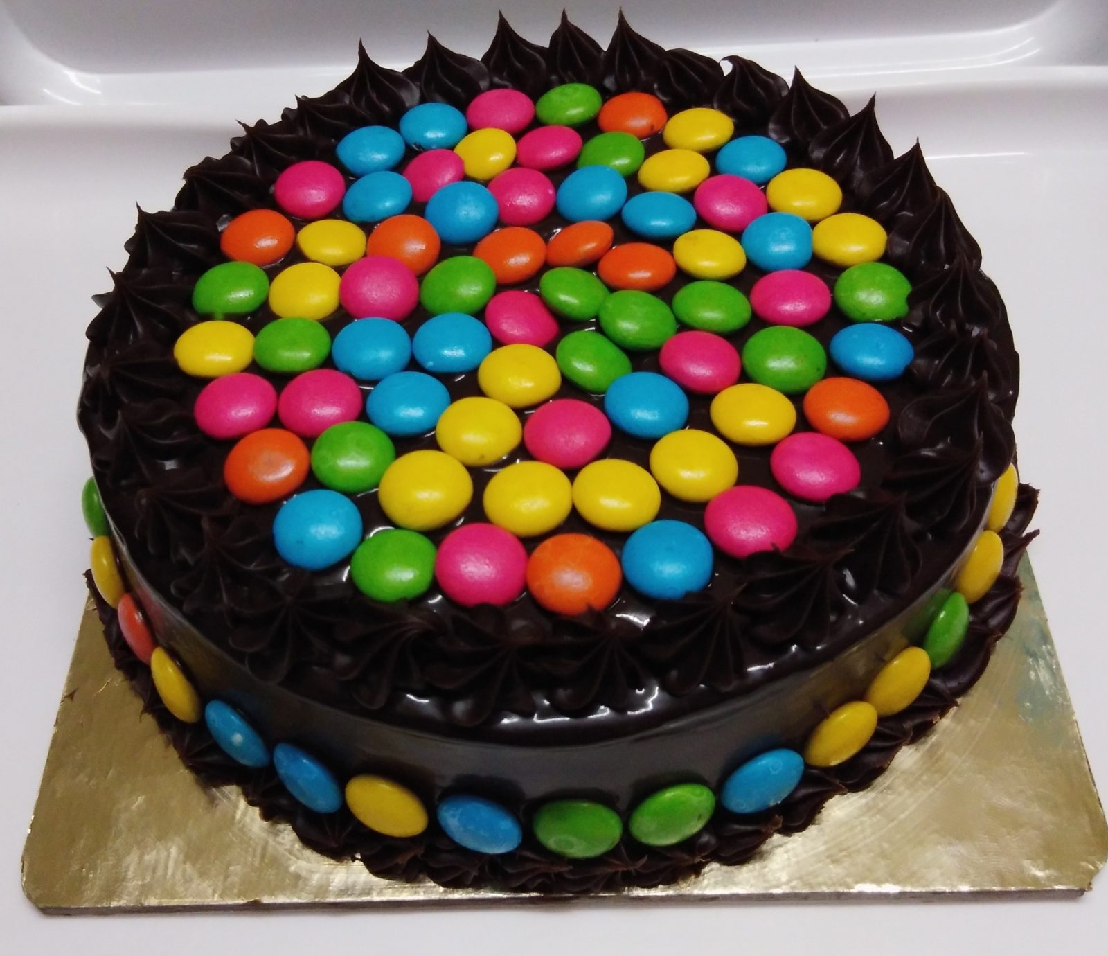 Send Online half kg eggless gems oreo chocolate cake Order Delivery |  flowercakengifts